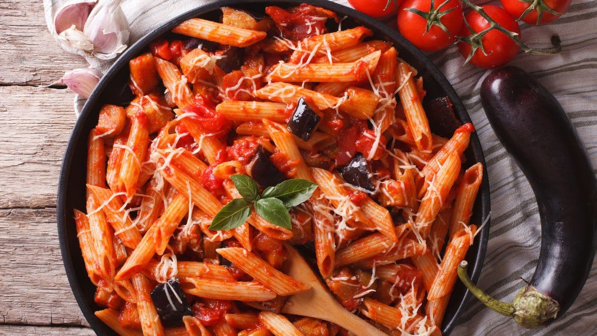 Wide image of pasta alla norma.