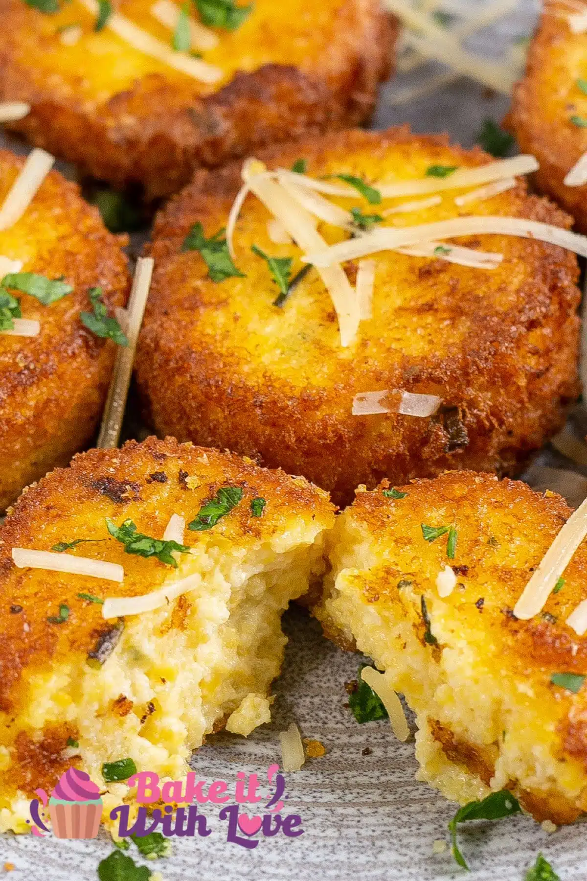 Closeup on the golden fried polenta cakes cut open to show the tender filling.