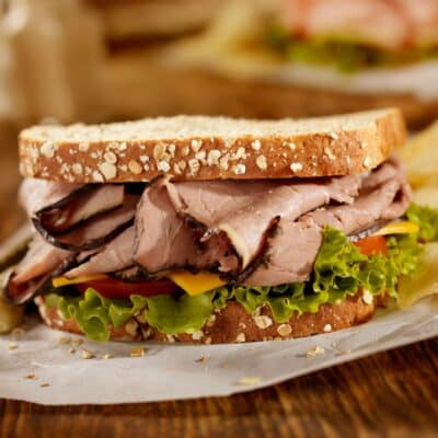 Square image of a roast beef sandwich.