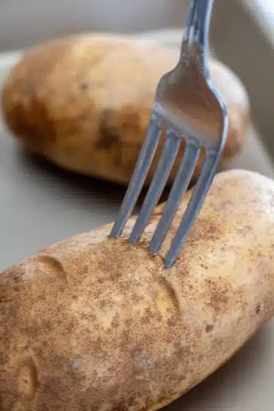 Process image 1 showing piercing potato with fork.