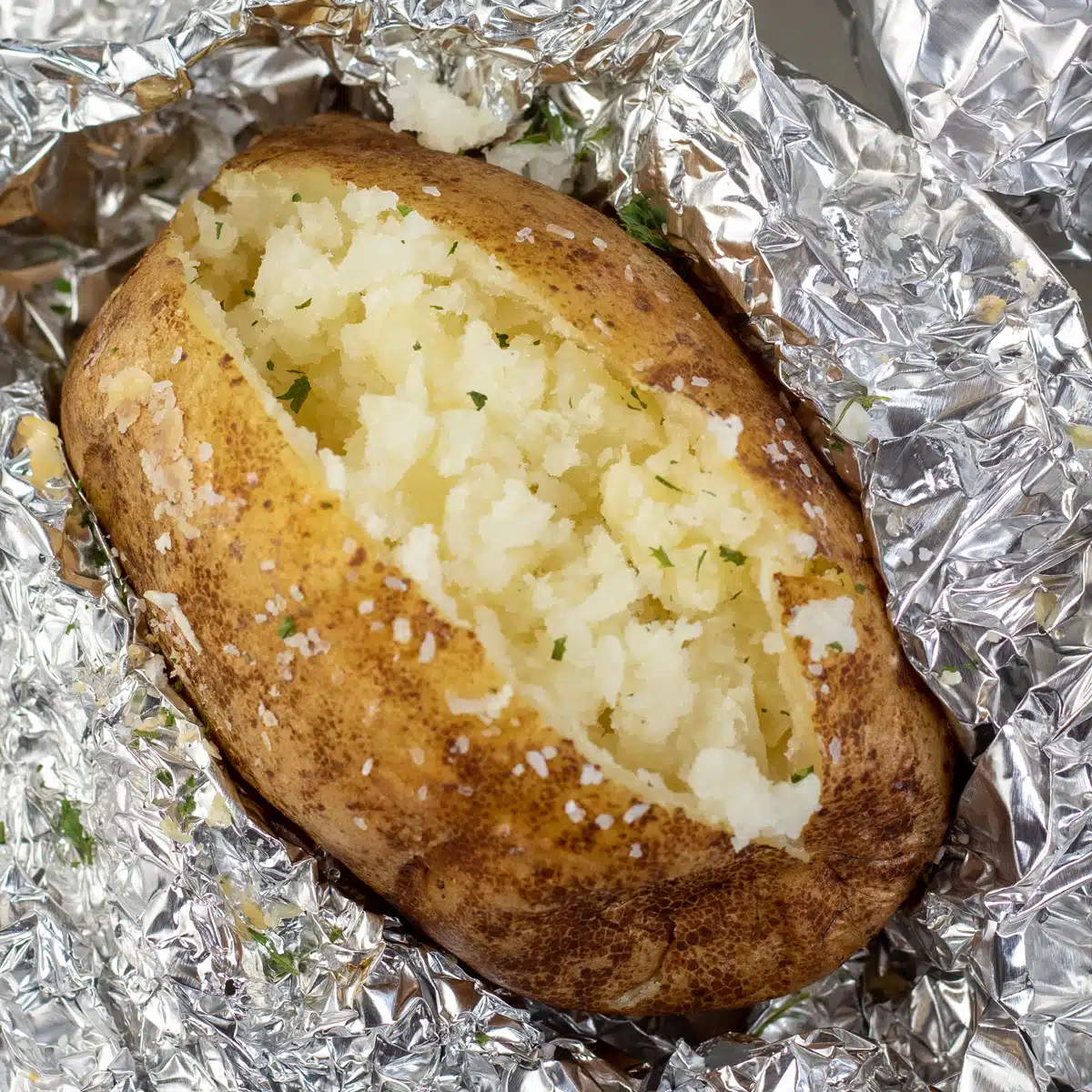 Square image showing slow cooked baked potato.