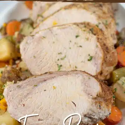 Pin image with text of sliced slow cooker pork loin.