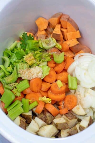 Process image 3 showing veggies in slow cooker.
