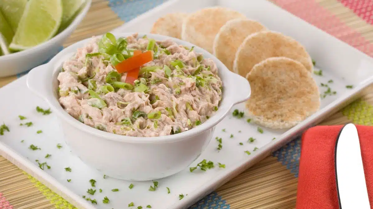 Wide image of a bowl of tuna dip.
