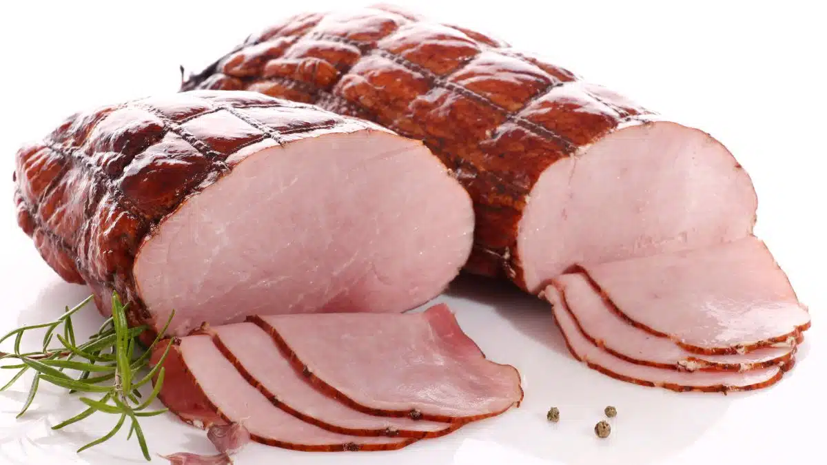 Wide image of a couple of hams on a white background.