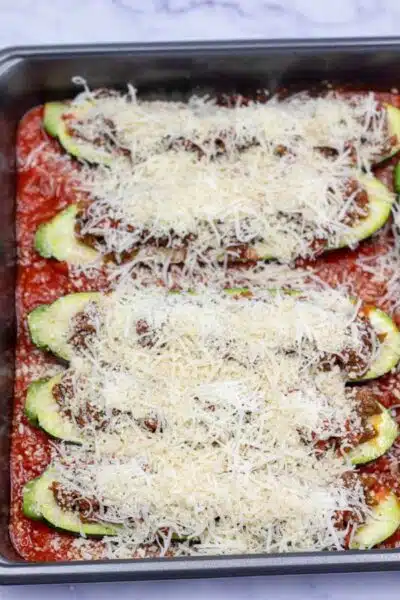 Process image 10 showing filled zucchini boats topped with cheese.