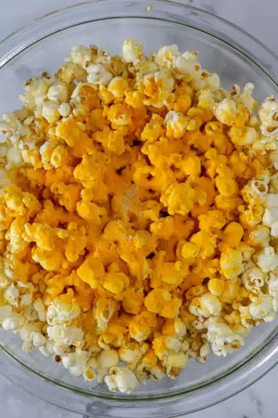 Cheddar popcorn process photo 4 add the cheddar cheese powder.