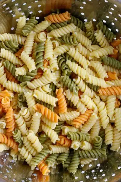 Process image 3 showing boiled pasta noodles in colander.