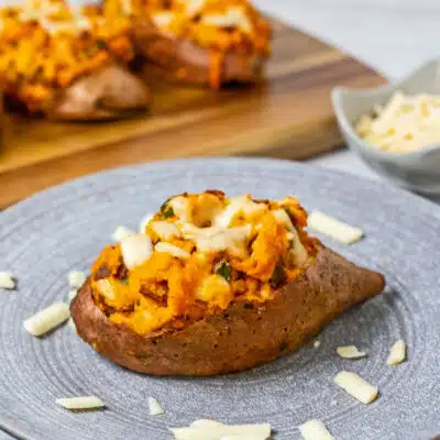 Best twice baked potatoes with savory filling served with more cheese on the side.