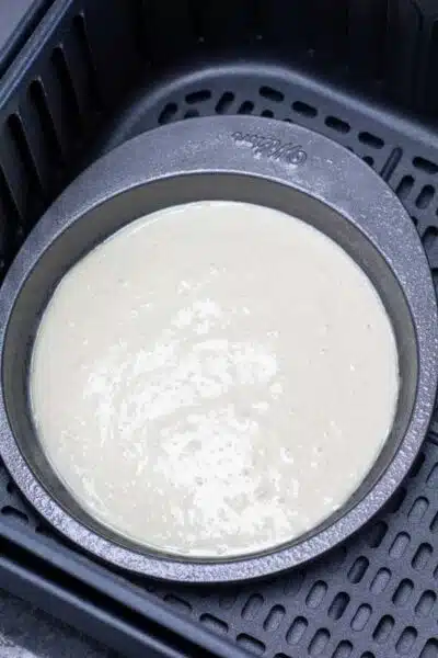 Process image 8 showing pancake batter in pancake pan in the air fryer.