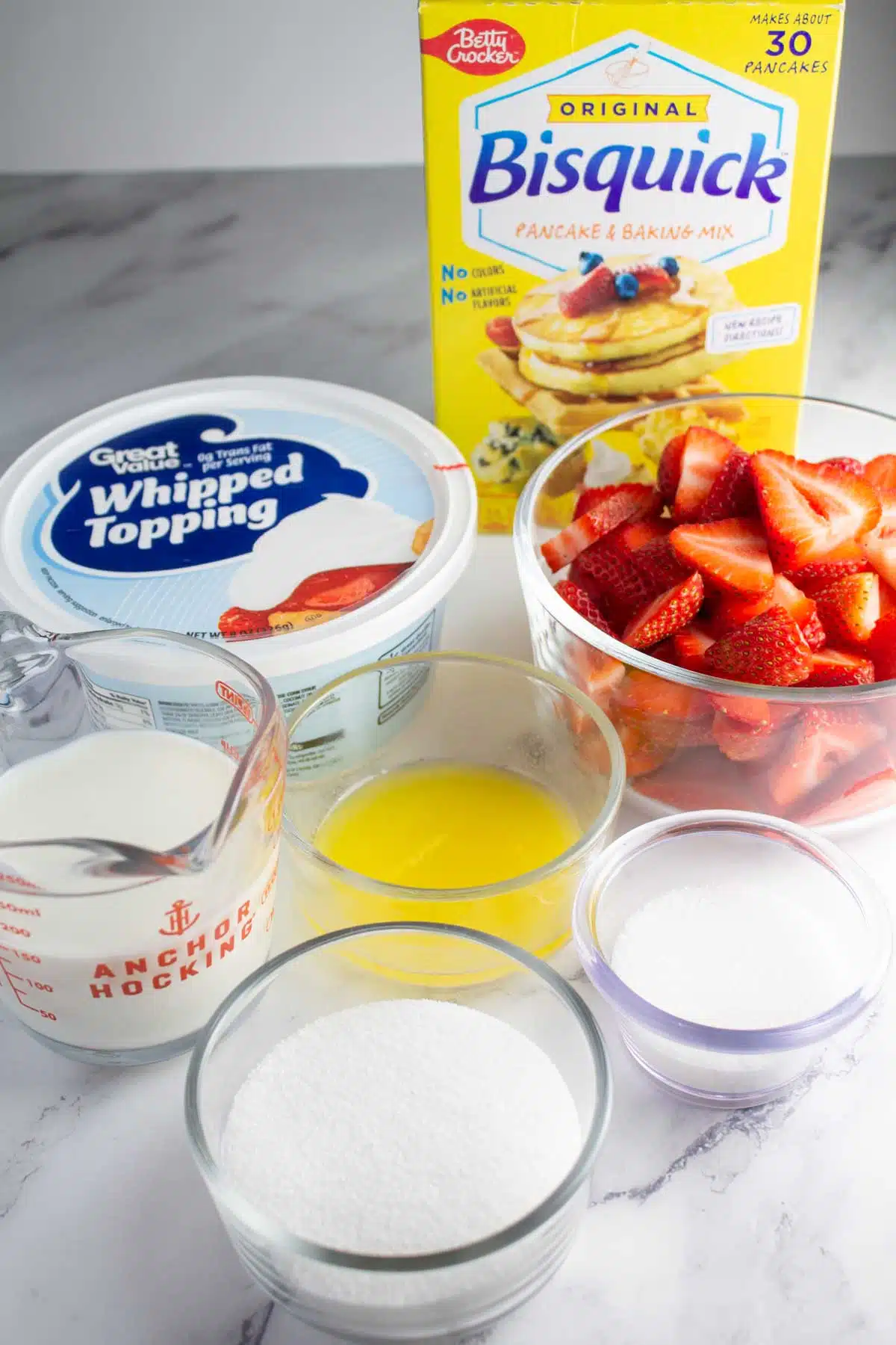 Tall image showing ingredients needed for Bisquick strawberry shortcake.
