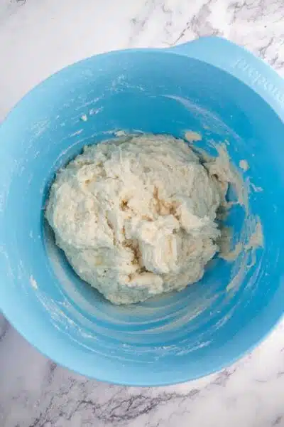 Process image 4 showing dough ingredients combined in a mixing bowl.