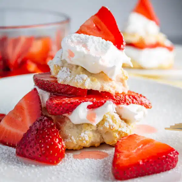 Square image of Bisquick strawberry shortcake on a white plate.