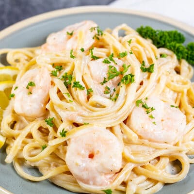 Square image showing creamy prawn pasta.