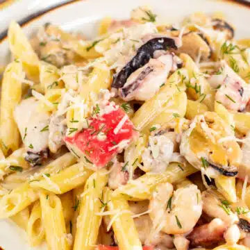 Wide image of creamy seafood pasta.