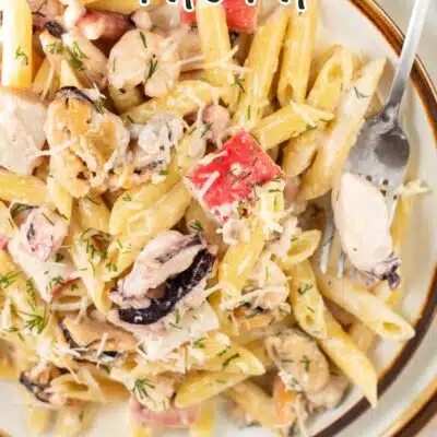 Pin image with text of creamy seafood pasta.