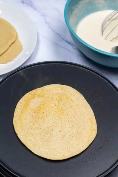 Process image 9 showing flipped Dutch pancake.