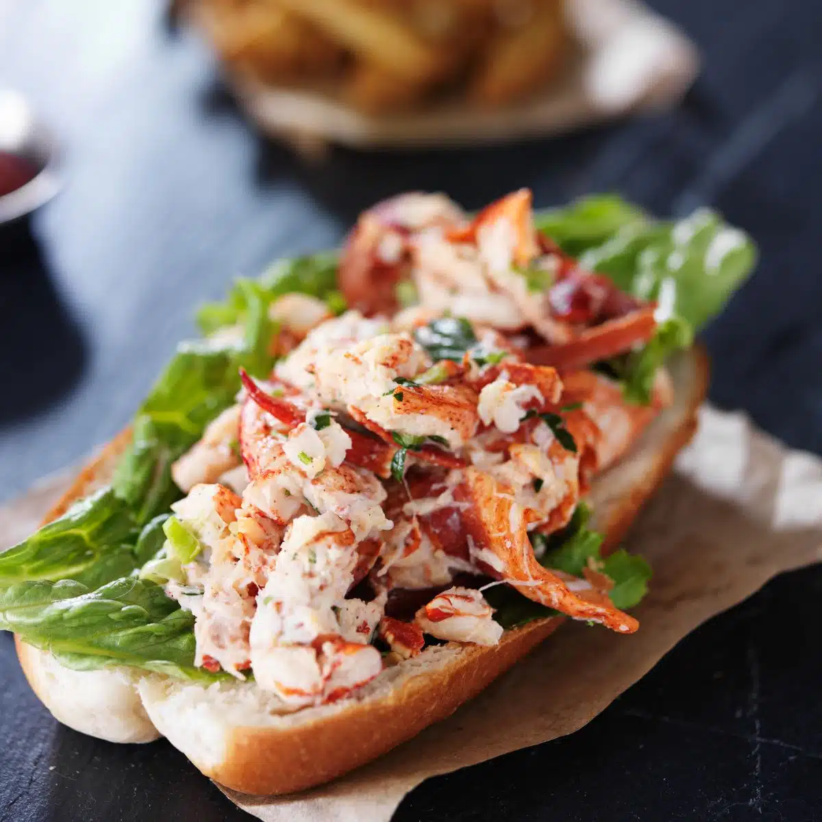 Square image of a lobster roll.