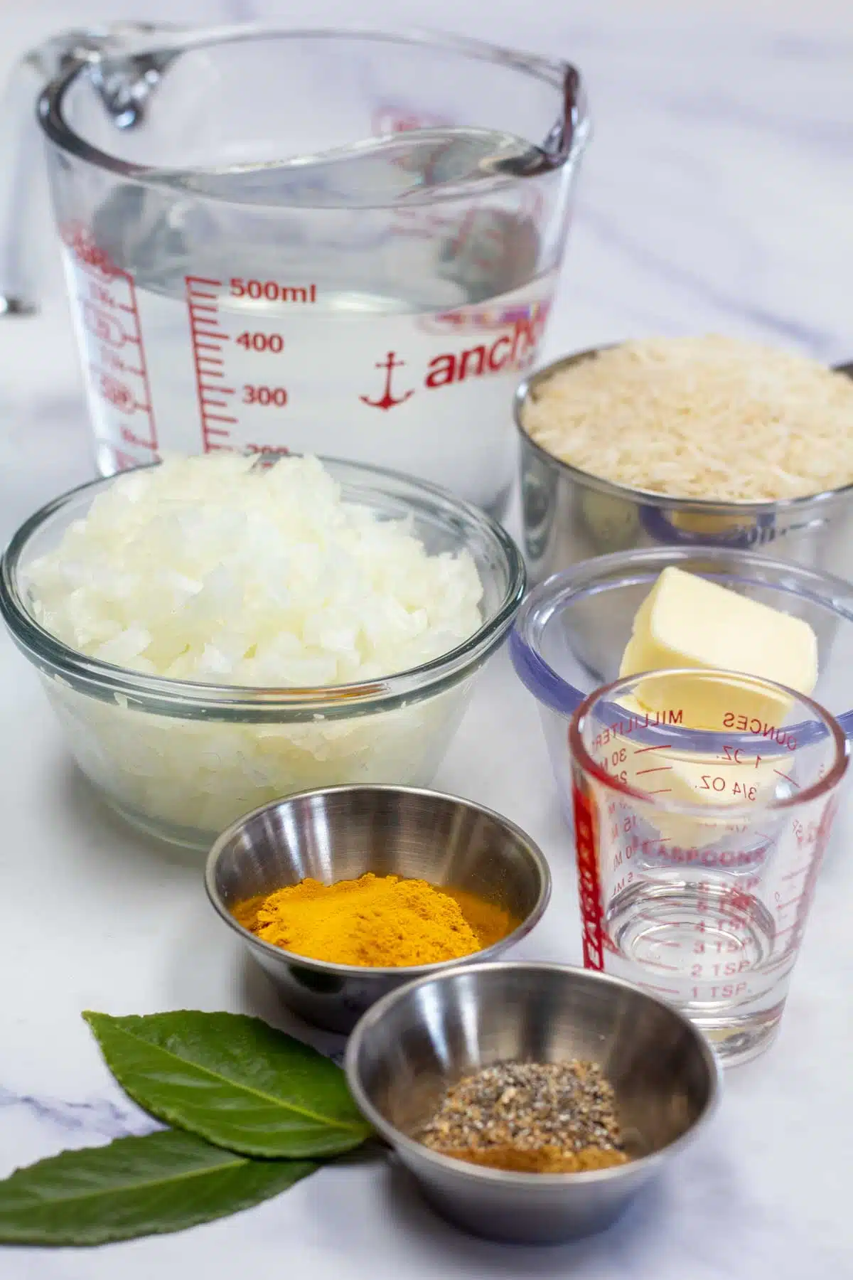 Tall image of pilau rice ingredients.