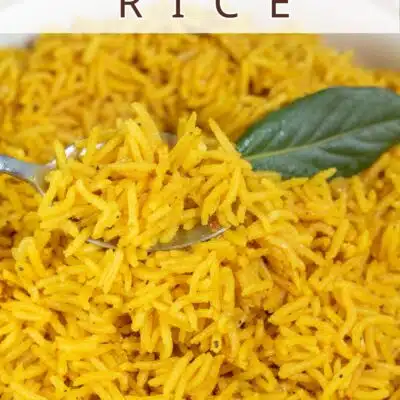 Pin image with text of pilau rice in a white bowl with a bay leaf.