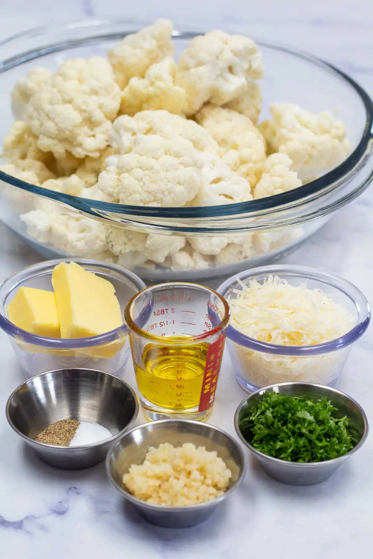 Tall image of ingredients needed for sauteed cauliflower.