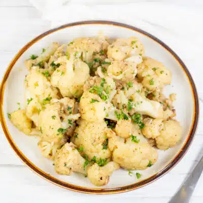Square image of a plate of sauteed cauliflower.