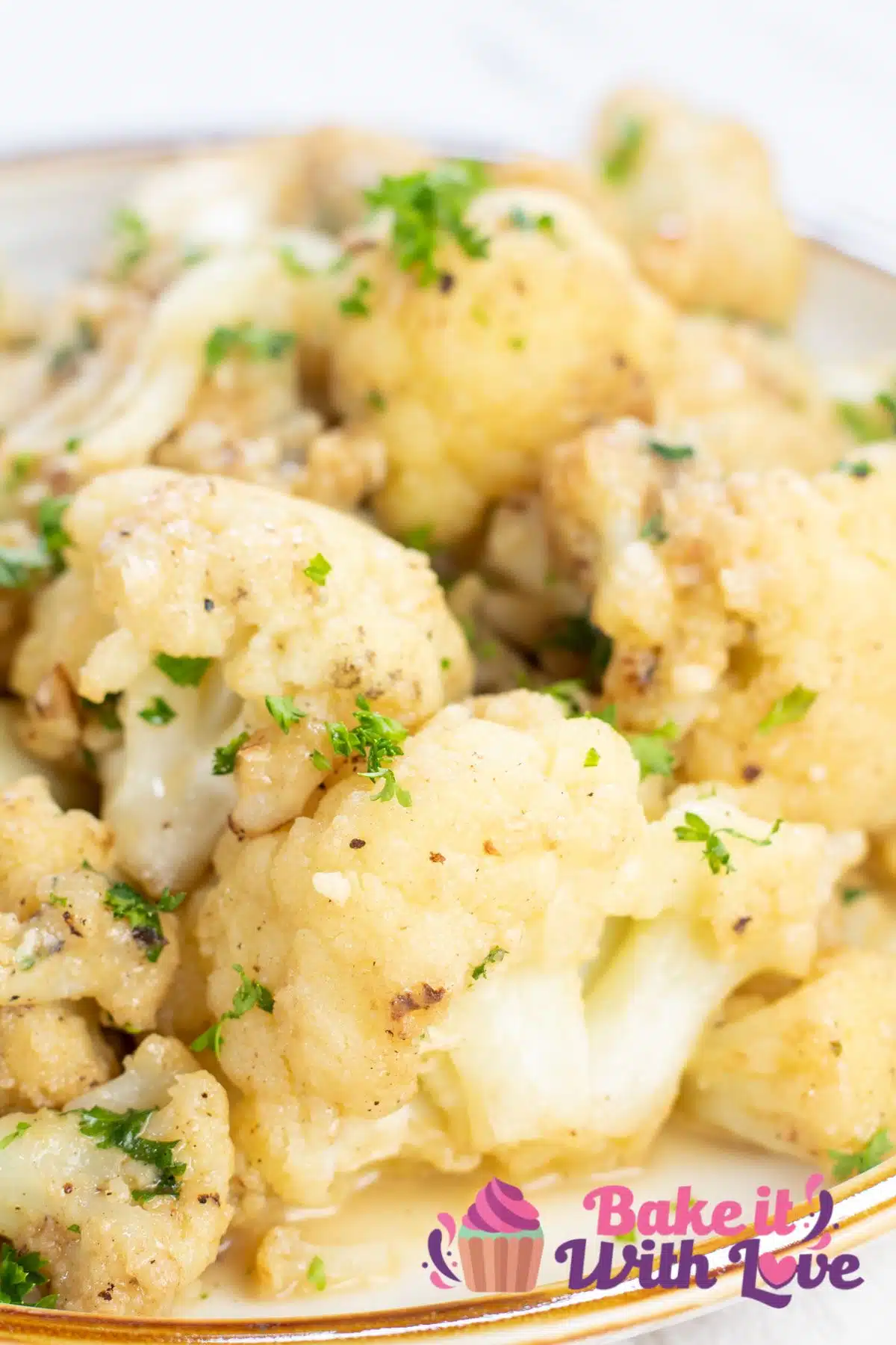 Tall image of a plate of sauteed cauliflower.