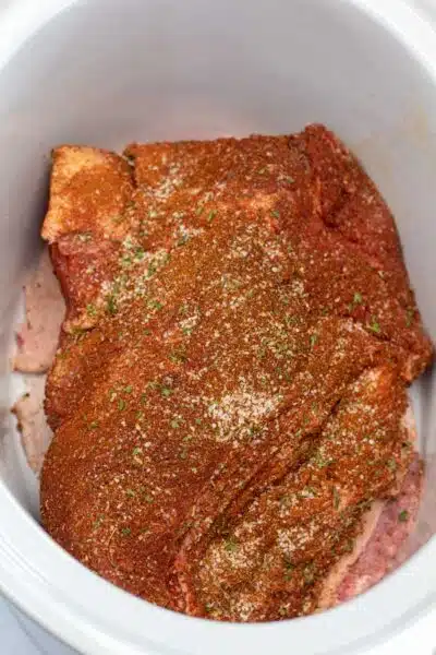 Process image 2 showing brisket in slow cooker.