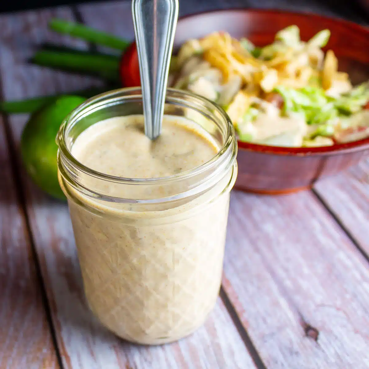 Square image of Southwest dressing in a glass jar.