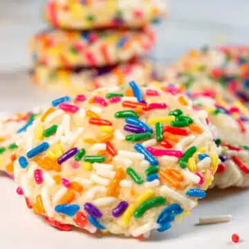 Wide close up image of sprinkle cookies.
