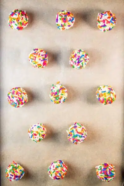 Process image 5 showing cookie dough balls on a baking sheet.