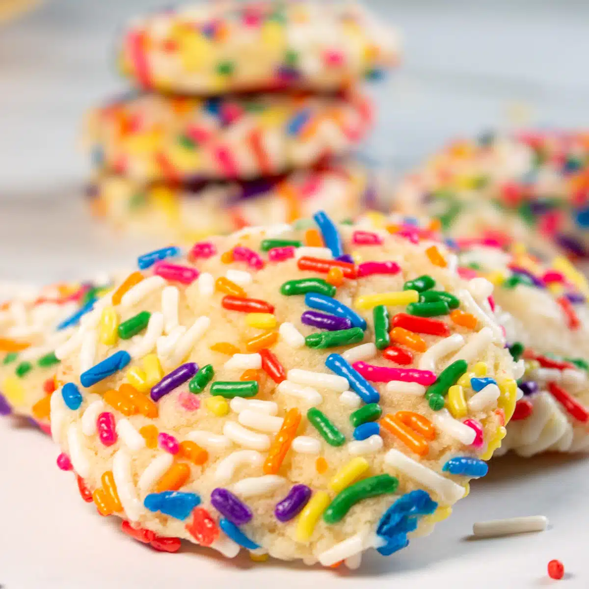 Square image of sprinkle cookies.