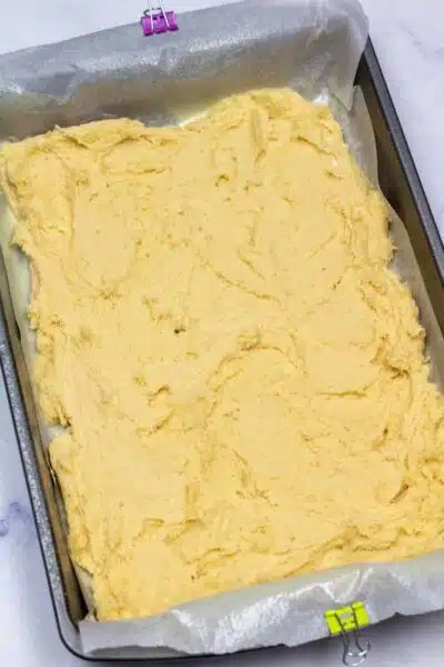 Process image 7 showing sugar cookie dough in baking dish.