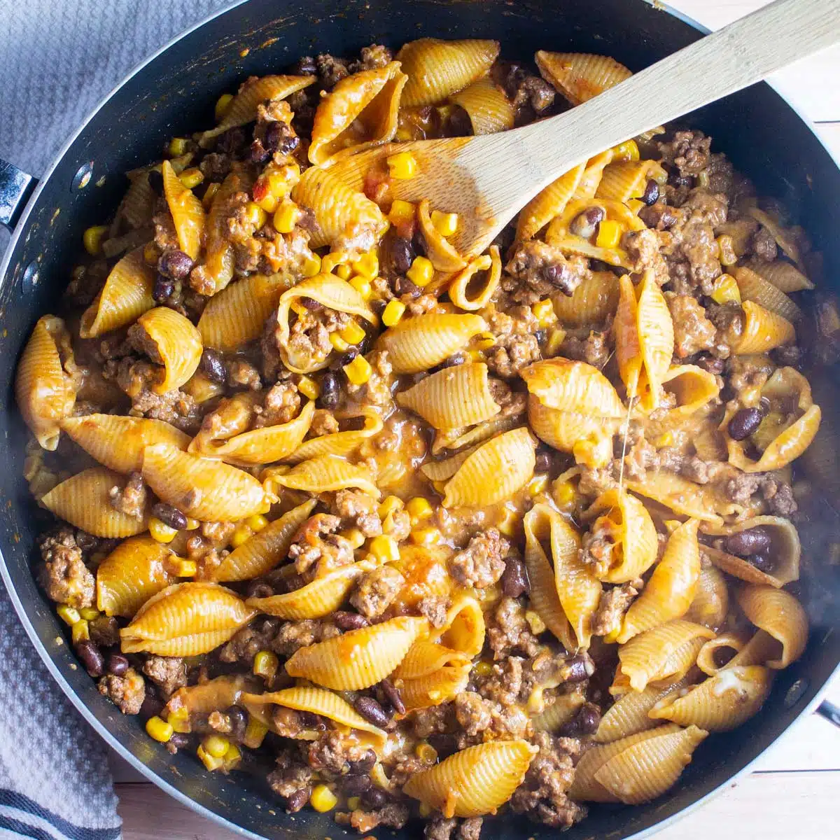 Square image of taco pasta in a large skillet.