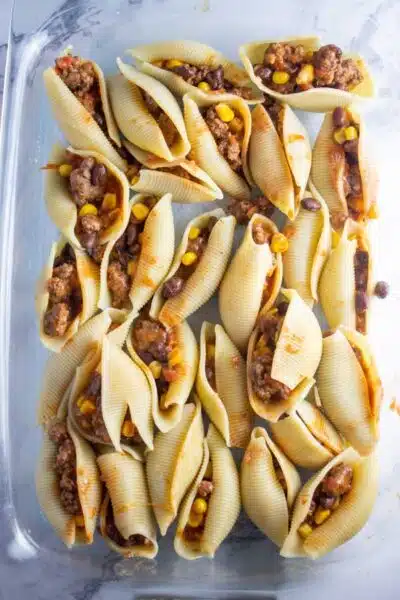 Process image 7 showing stuffed pasta shells in a baking dish.