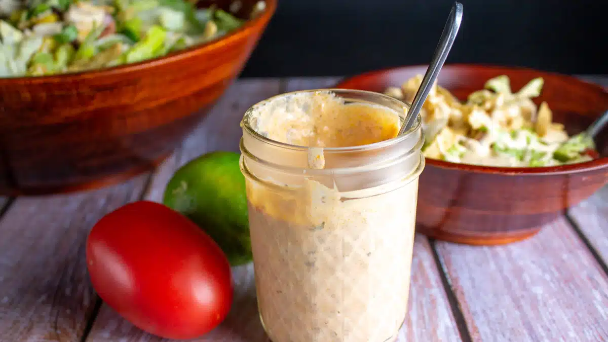 Wide image of Tex-Mex dressing in a glass jar.
