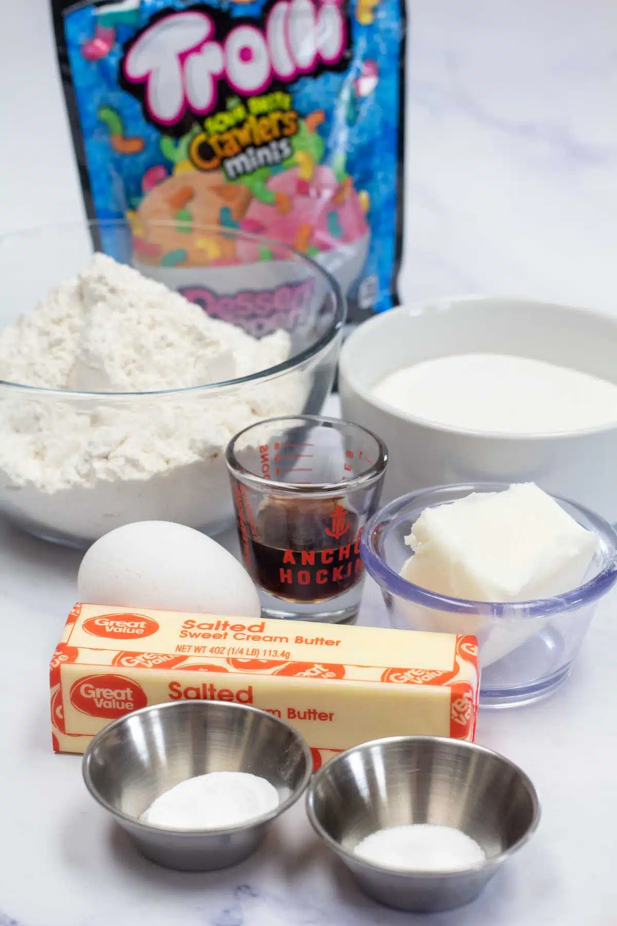 Tall image showing ingredients needed for Trolli sour brite crawlers cookies.