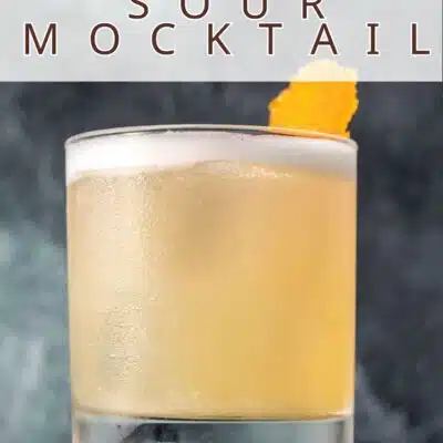 Pin image with text of a whiskey sour mocktail.