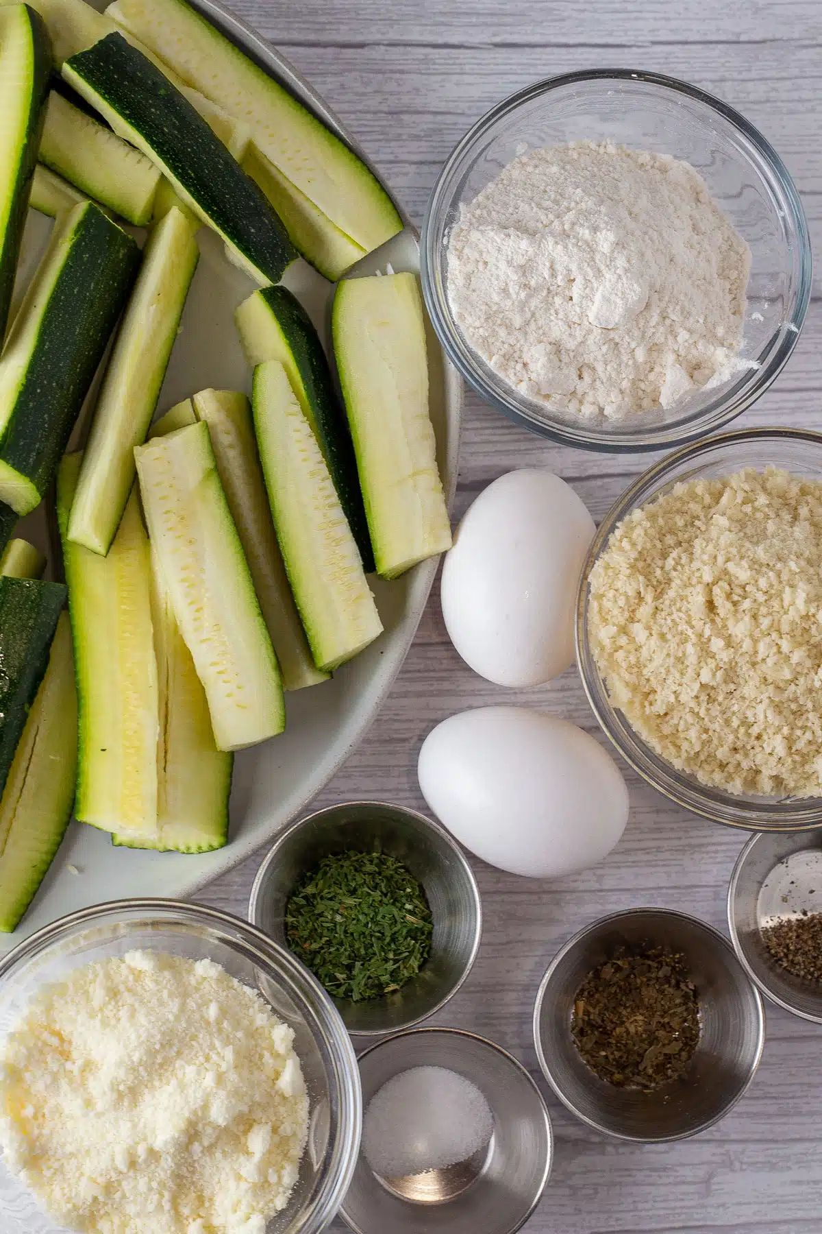 Tall image showing air fryer zucchini ingredients.