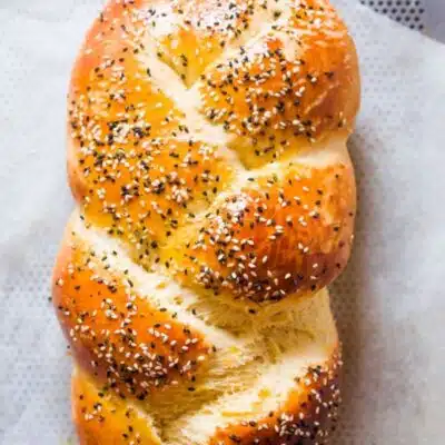 Pin image with text of challah bread.
