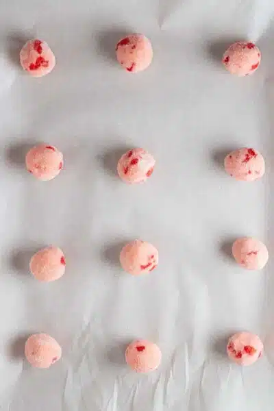Process image 9 showing cookie dough balls on baking sheet.