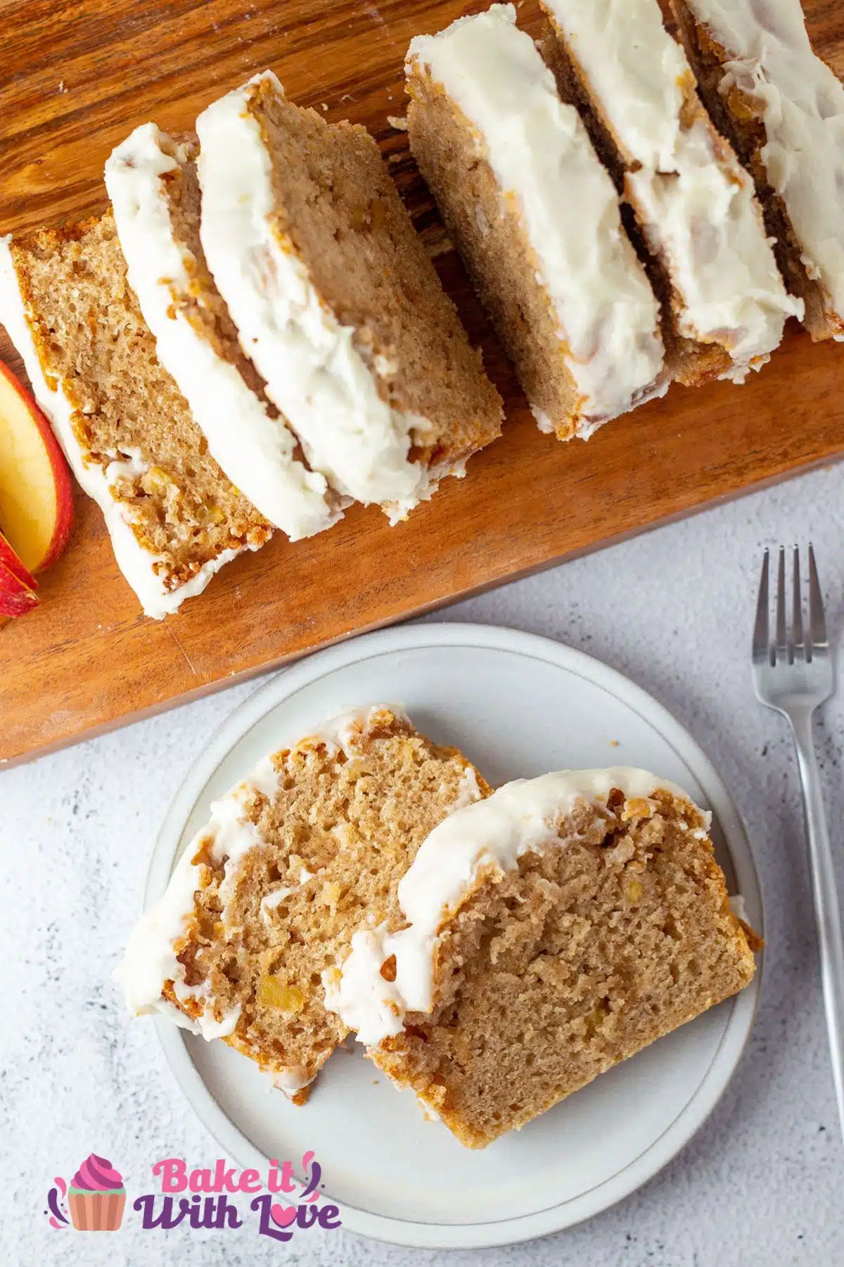 Tall image of cinnamon apple bread sliced and on a white plate.