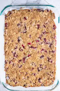 Process image 9 showing baked cranberry crumble ready to be cut into bars.
