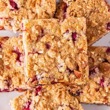 Wide image of cranberry crumble bars.
