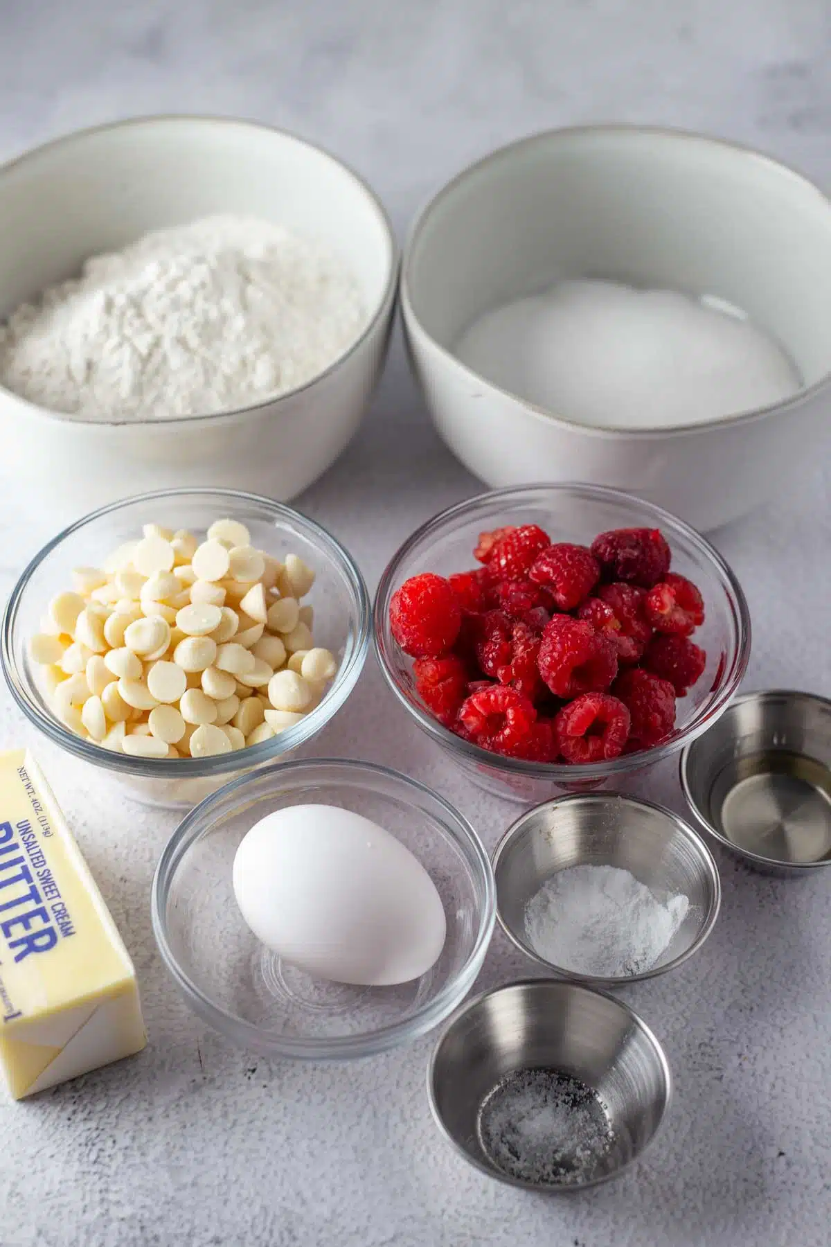 Tall image showing ingredients needed for raspberry white chocolate blondies.