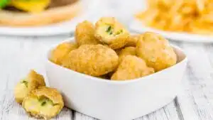 Wide image of air fryer chili cheese nuggets.