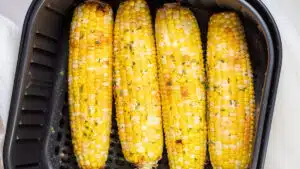 Wide image of air fryer corn on the cob.