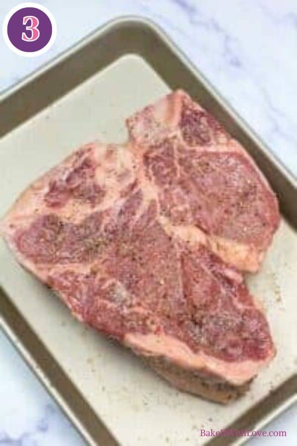 Bistecca alla fiorentina process photo 3. A large raw Bistecca alla Fiorentina steak (T-bone or porterhouse cut) seasoned with spices, lying on a light-colored baking sheet. A purple circle with the number '3' is visible in the top left corner.