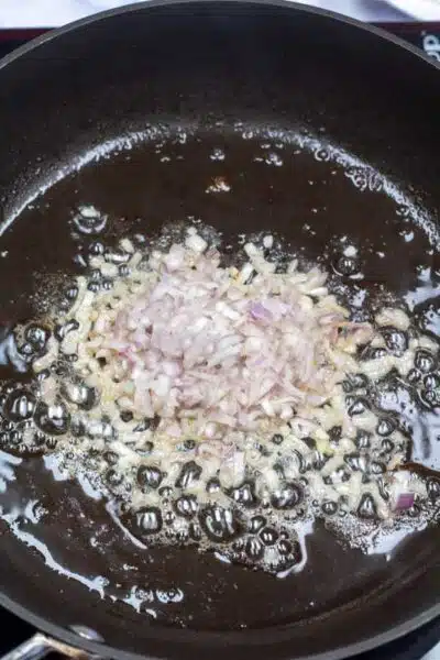 Process image 2 showing sauteing shallots in bacon grease.