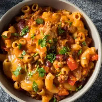 Wide image of chili mac in a bowl.